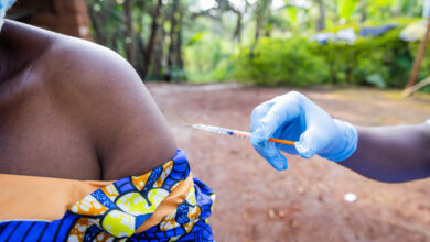 A woman's shoulder ready to receive a vaccine from a general practitioner
