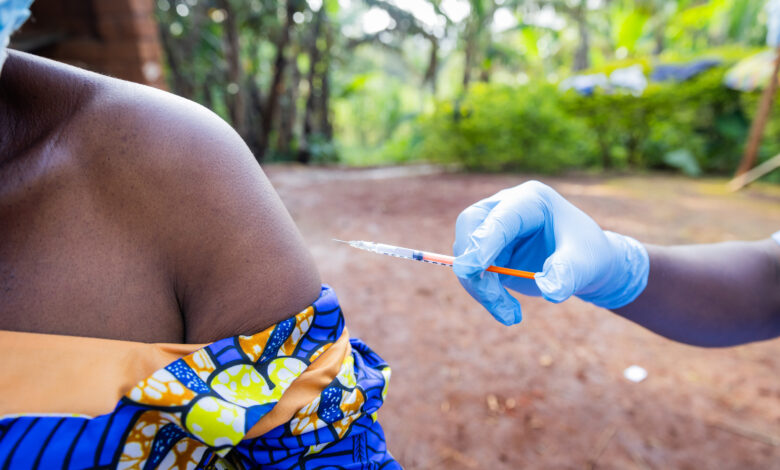 A woman's shoulder ready to receive a vaccine from a general practitioner